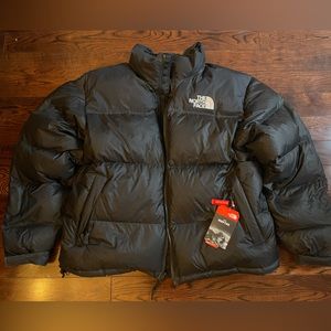 Brand New, with tags The North Face black jacket. Size XL, includes hood